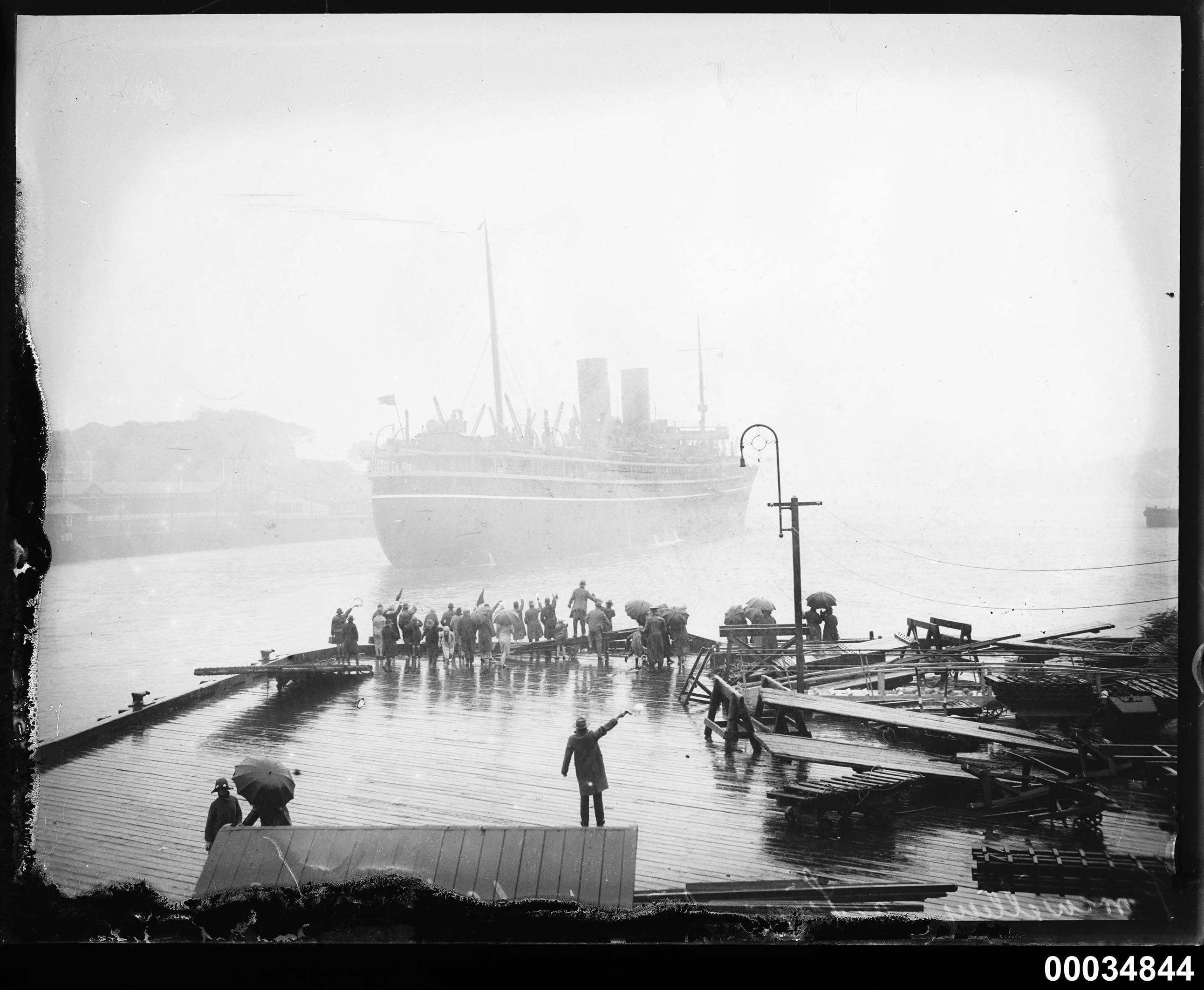 Passenger vessel, possibly SS MOOLTAN III, leaving the P&O wharf in Sydney Cove